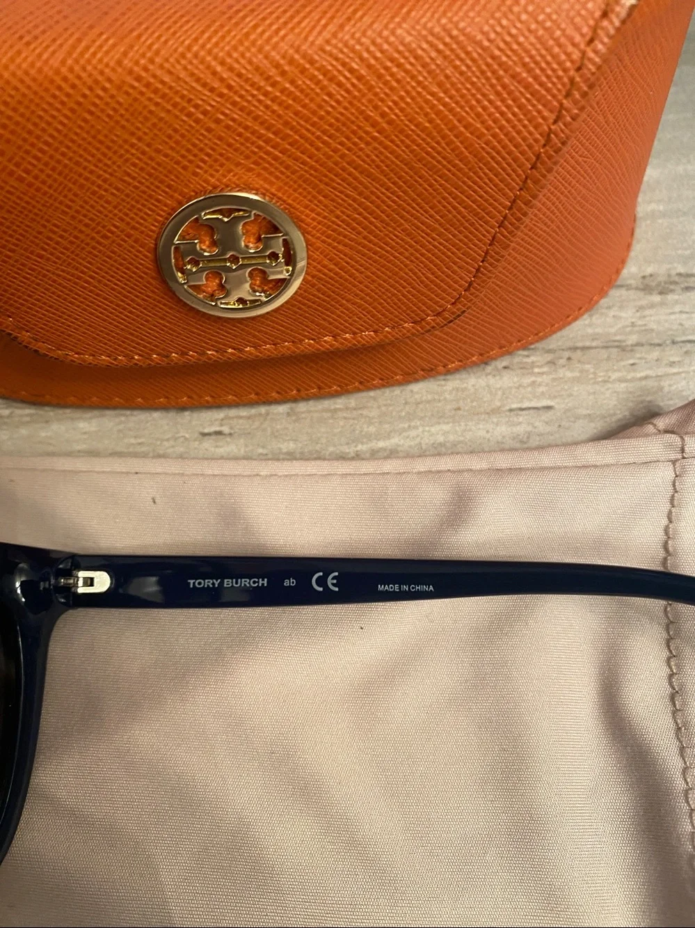 Tory Burch Navy sunglasses with cases.